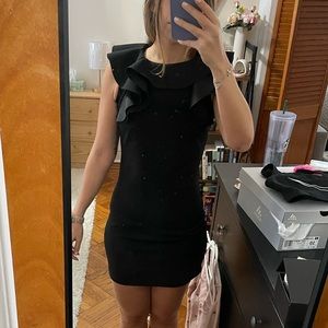 Little black dress with ruffle neck